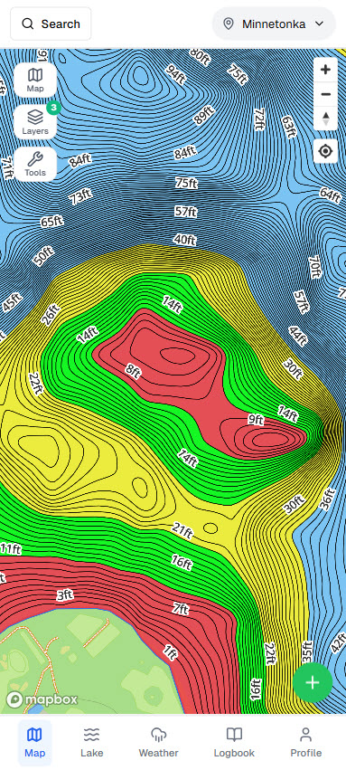 Fish Guide Pro depth-shading contour map of Lake Minnetonka's deep basin, with blue contour rings descending past 90 feet next to a shallower nearshore hump along a wooded shoreline